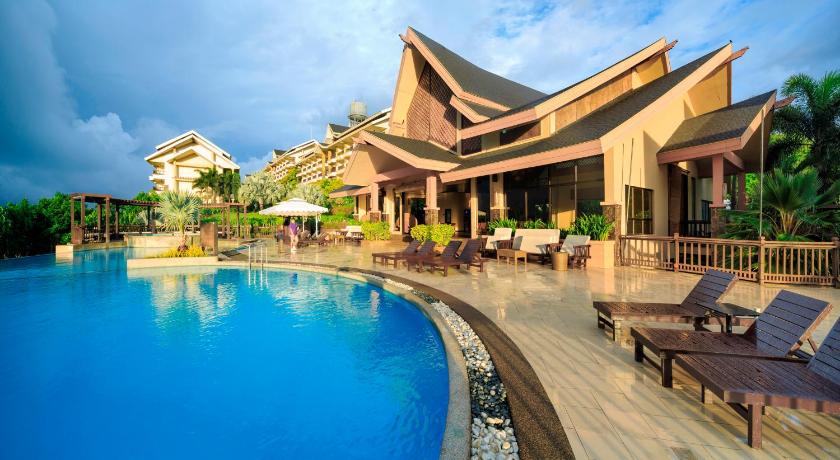 a hotel room with a pool and a balcony, Alta Vista de Boracay Hotel in Boracay Island