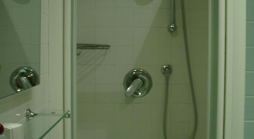 a bathroom with a shower, sink, and mirror, Hotel Gala in Pesaro