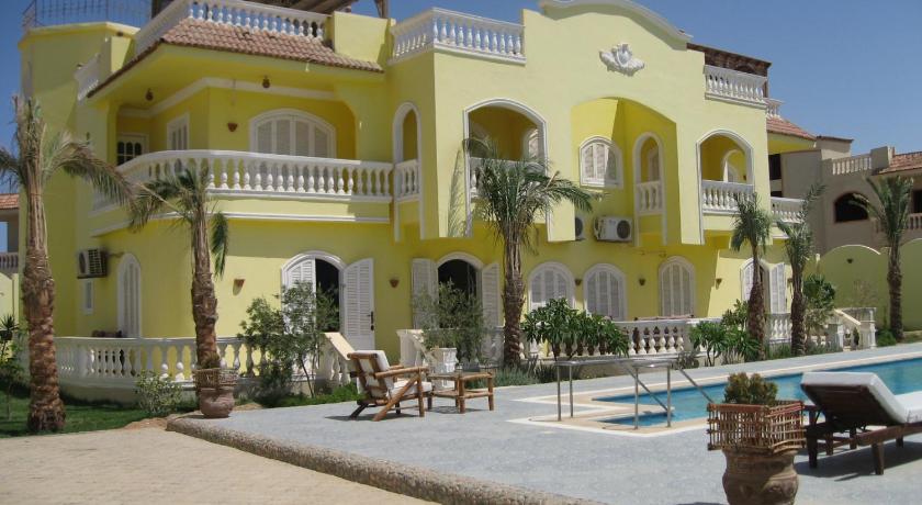a house with a pool and a balcony, Villa Shahrazad Hurghada in Hurghada