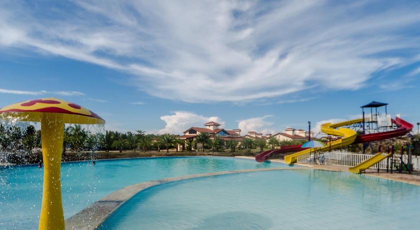 a swimming pool filled with lots of colorful umbrellas, Espacio Verde Resort in Roxas City (Capiz)