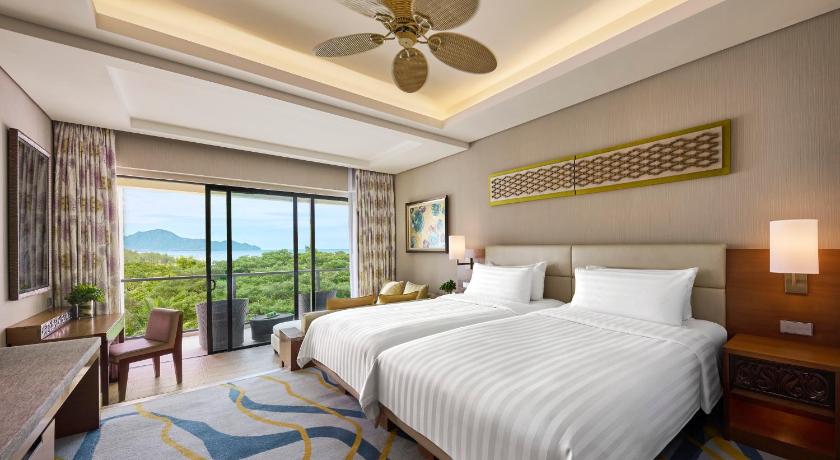 Immagine di Camera Deluxe Doppia con Letti Singoli con Vista Mare - Ala Giardino (Garden Wing Deluxe Twin Room with Sea View) 0