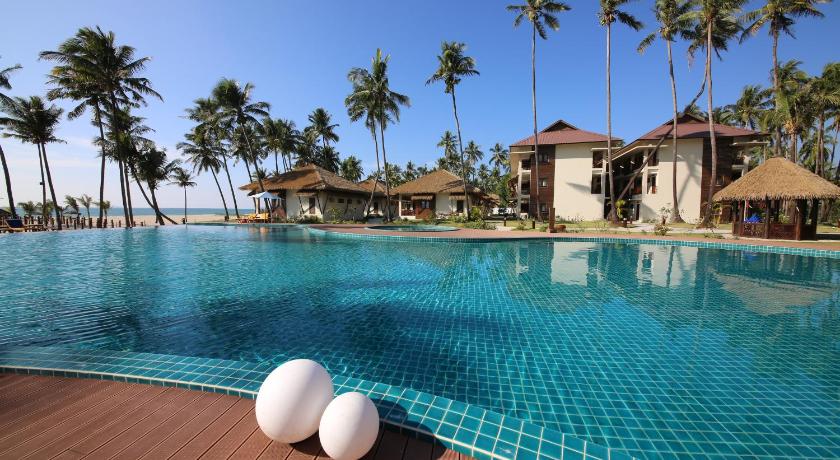 a swimming pool with a tennis racket and a blue chair, Eskala Hotels & Resorts in Ngwesaung Beach