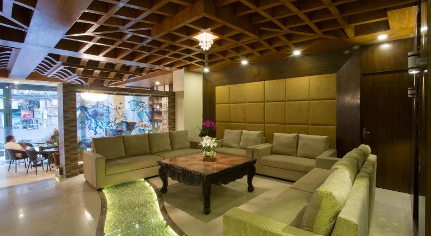 a living room filled with furniture and a large window, Yatri Suites and Spa in Kathmandu