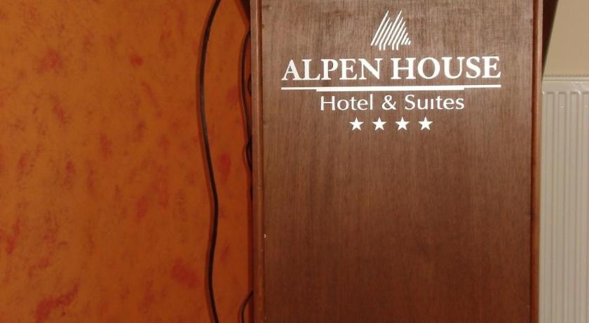 an old record player sitting on top of a wooden table, Alpen House Hotel & Suites in Arachova