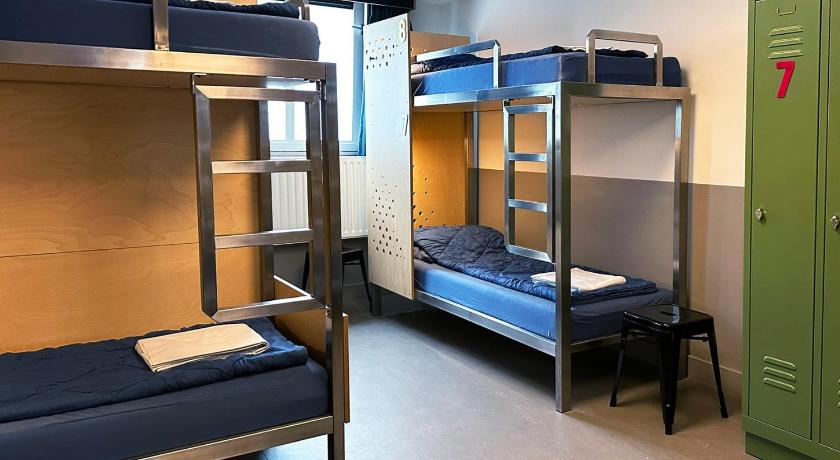 Image of Bed in 10+ Bed Mixed Room with Shower 1