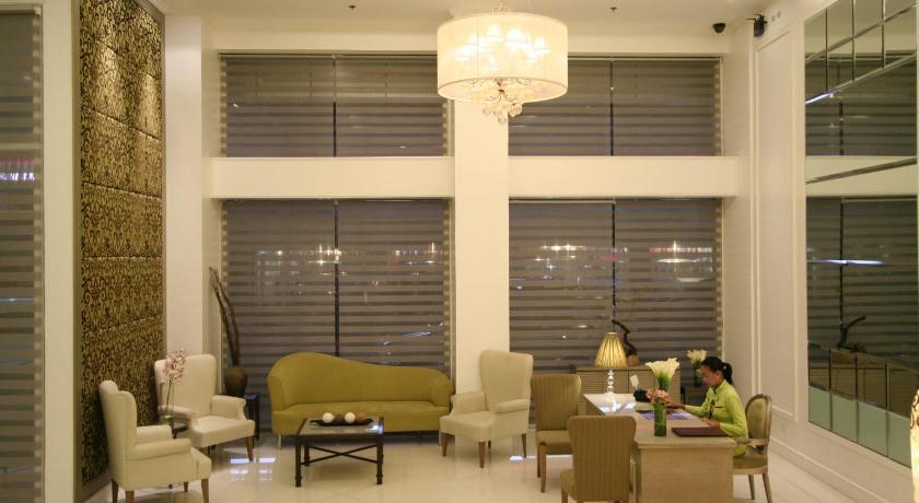 a living room filled with furniture and a large window, Hotel St. Ellis in Legazpi