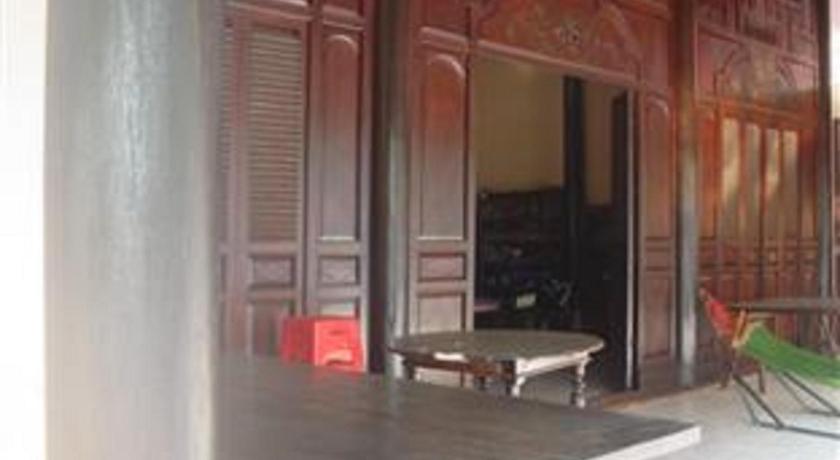 a room with a wooden table and a large window, Chau Doc Home Stay in Chau Doc (An Giang)