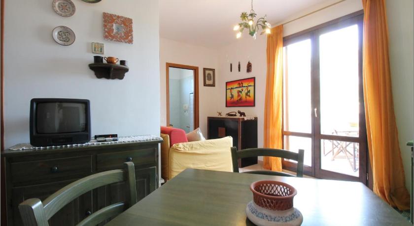 a living room filled with furniture and a tv, Senia in San Vito Lo Capo