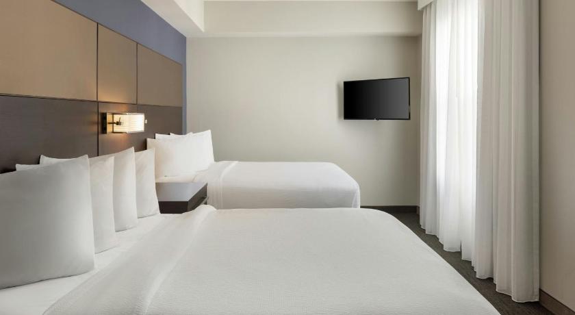 Image of 2 Bedroom Larger Suite, Bedroom 1: 1 King, Bedroom 2: 2 Queen, Sofa Bed 5