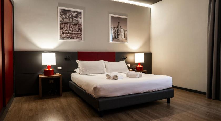 Image of Superior Room with One Double Bed, One Single Bed and Sofa Bed 1