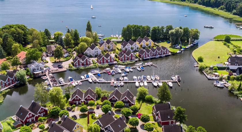 a marina filled with lots of boats on a body of water, Marinapark Scharmutzelsee in Wendisch Rietz