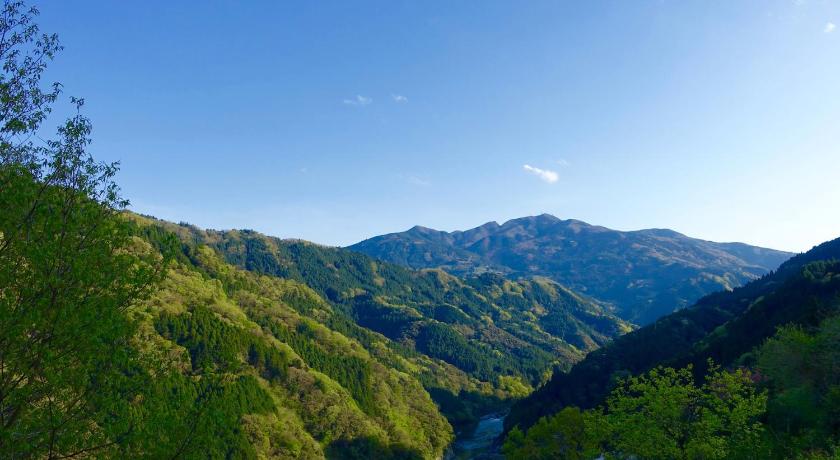 a mountain range with a river and mountains, Oyamanoyado Michitsuji in Otoyo