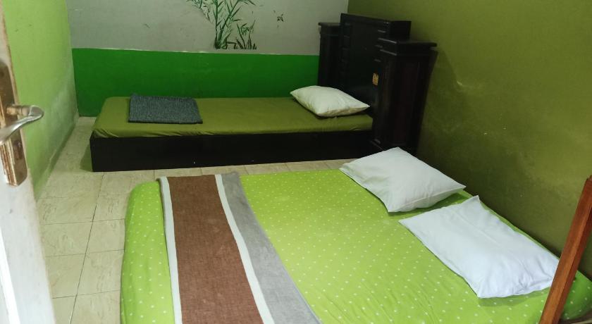 Image of Economy Triple Room with Shared Bathroom 0