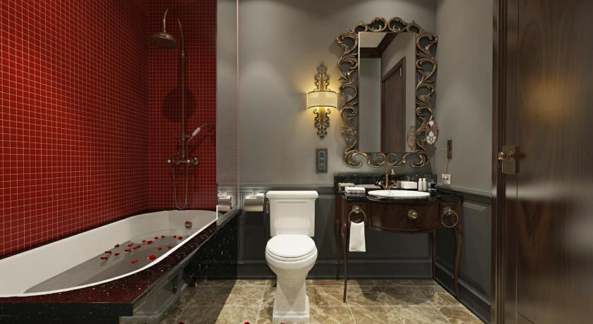 a bathroom with a toilet, sink, and bathtub, The Scarlett Boutique Hotel Hue in Hue