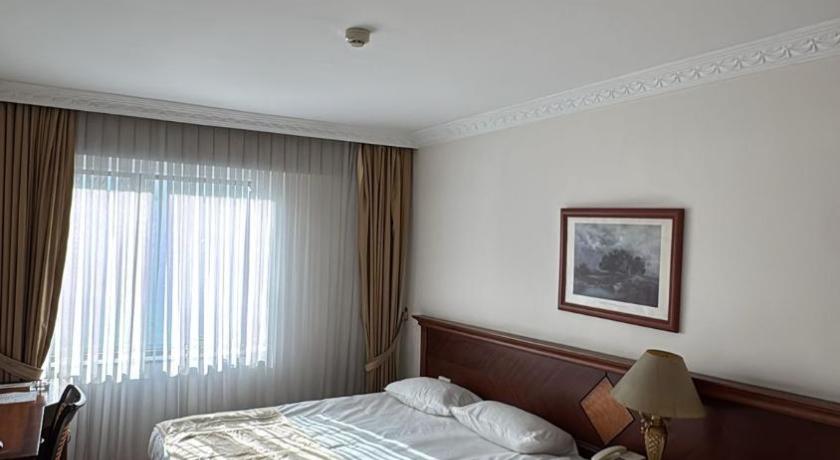 صورة غرفة قياسية ثلاثية (Standard Triple Room) 1