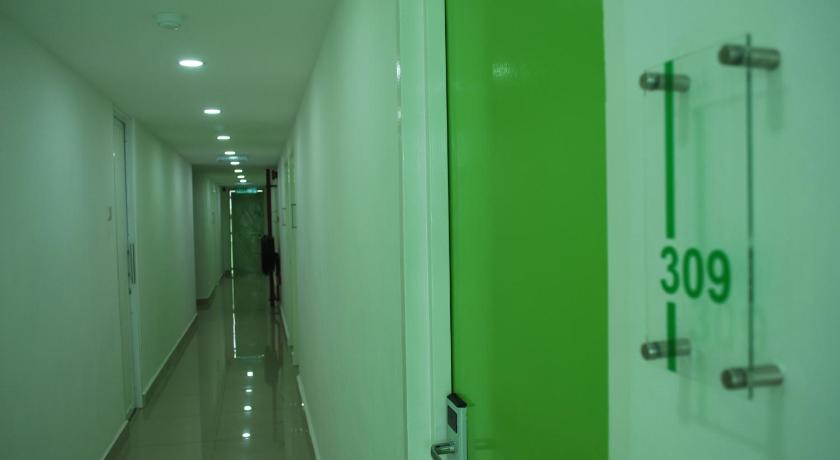 a hallway with a green wall and a blue wall, Apple Inn Hotel in Sungai Petani