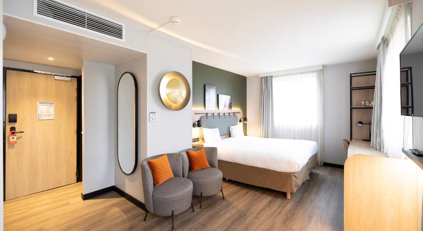Image of Quadruple Room with One Double Bed and Two Single Beds or Sofa Bed 0