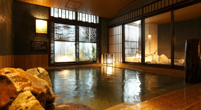a large pool of water in the middle of a building, Dormy Inn Premium Wakayama Natural Hot Spring in Wakayama