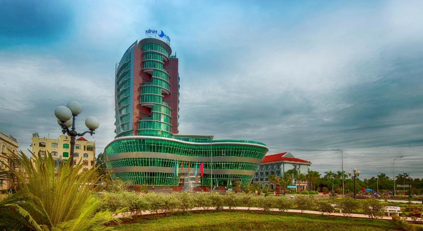 a large building with a clock on top of it, Ninh Kieu Riverside Hotel in Cần Thơ
