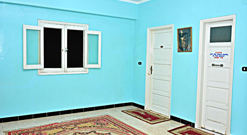 a room with blue walls and a blue floor, Fontana Luxor Hostel in Luxor