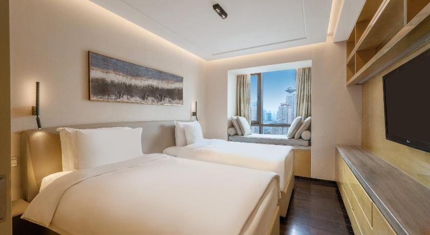 Image of One-Bedroom Twin Suite with Two Twin Beds, Dining Area and Kitchenette 0