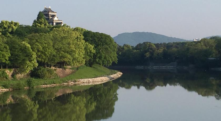 a large body of water surrounded by trees, Okayama Plaza Hotel in Okayama