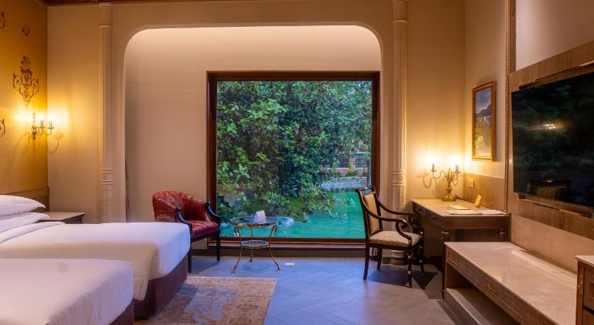 Image of regal suite, club lounge access, bedroom 1: 1 king, bedroom 2: 2 double, garden view 3