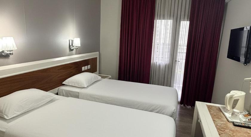 Imagem de Quarto com 2 Camas de Solteiro e Varanda (Twin Room with Balcony) 1