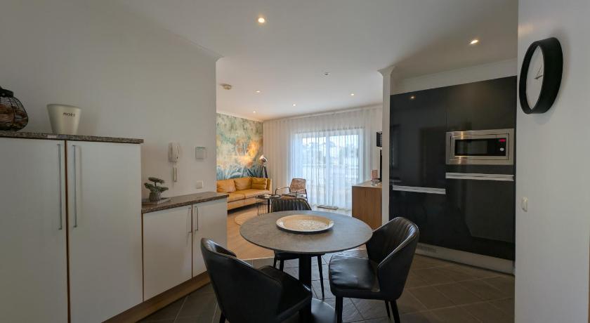 Image of One-Bedroom Apartment with Balcony and Water View 1