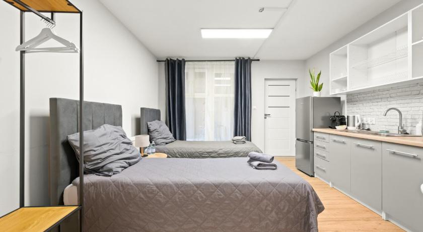 Photo de Central Platinum Apartments 5 Studio z aneksem kuchennym i tarasem - Réservation à prix Agoda