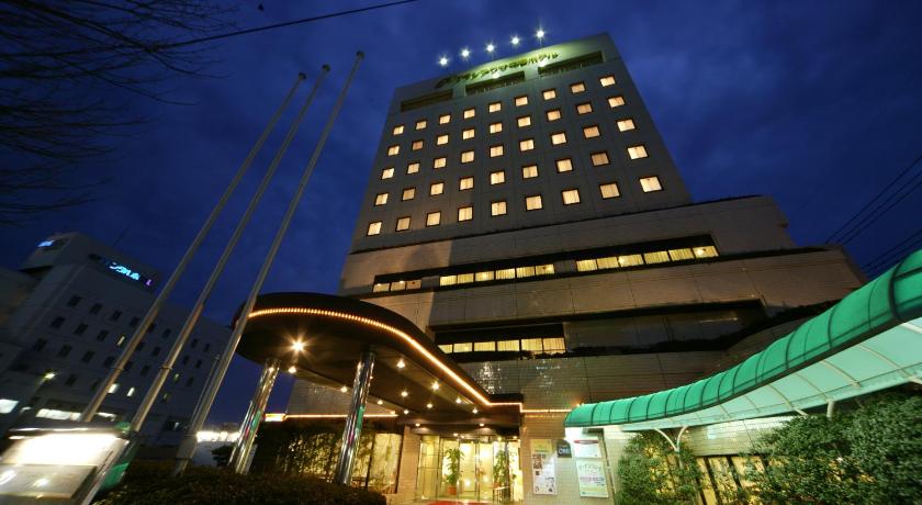 a large building with a clock on the side of it, Grand Plaza Nakatsu Hotel in Nakatsu