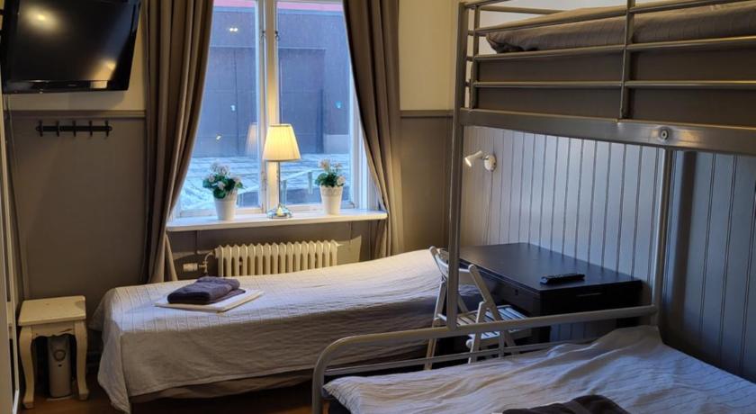 Image of Triple Room with Shared Bathroom 0