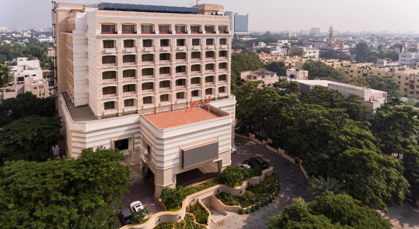 a large building with a clock on top, Grand Chennai by GRT Hotels in Chennai