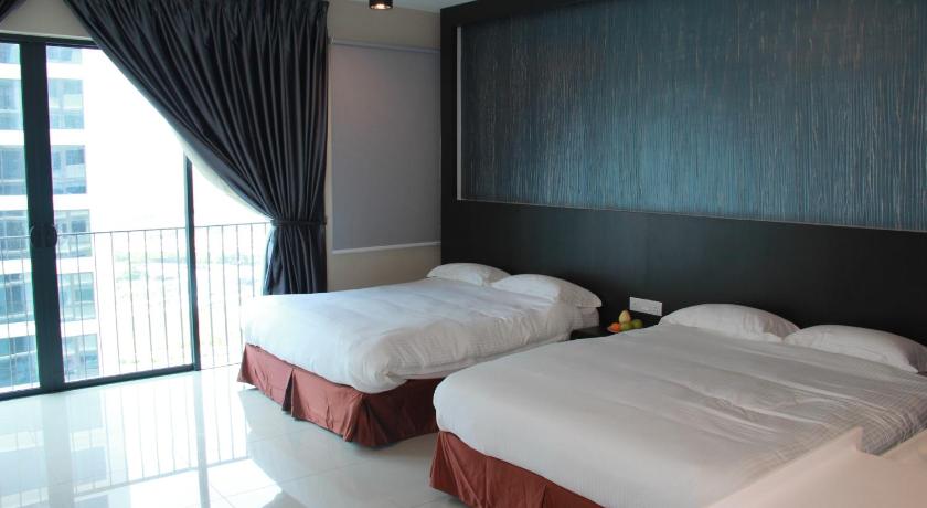 a hotel room with two beds and two lamps, Setia Inn Suites Service Residence in Shah Alam