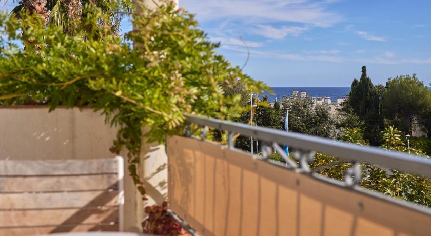 Image of Triple Room with Garden View and Balcony 1