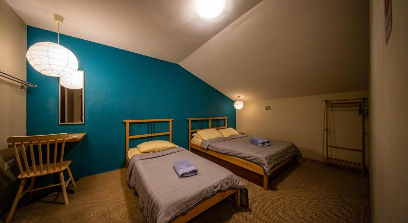 Image of Economy Triple Room with Shared Bathroom 1