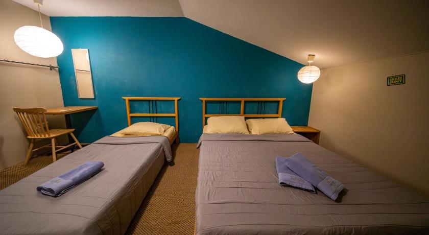 Image of Economy Triple Room with Shared Bathroom 2