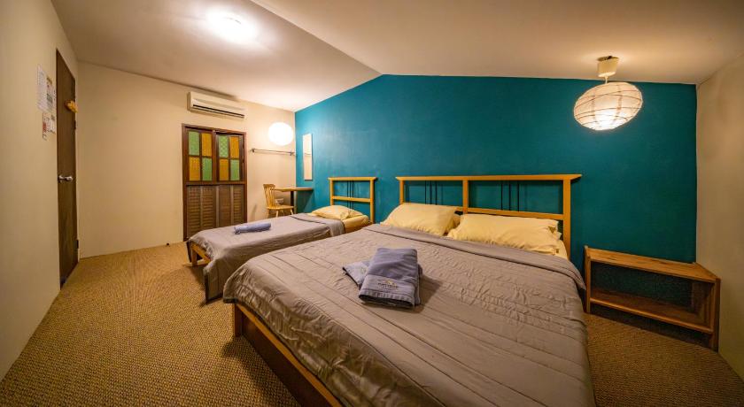 Image of Economy Triple Room with Shared Bathroom 0