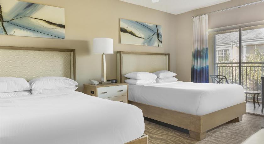 Image of Three-Bedroom Suite with One King Bed, Four Queen Beds, and Sofa Bed 0
