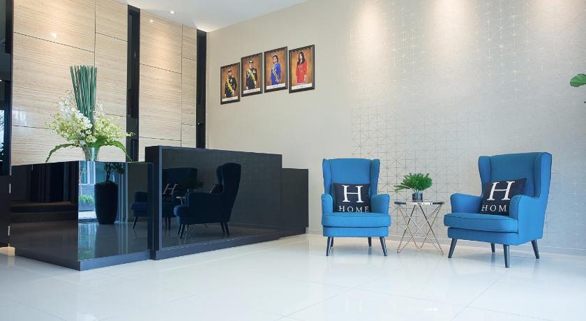 a living room filled with furniture and a tv, The Square Hotel in Johor Bahru