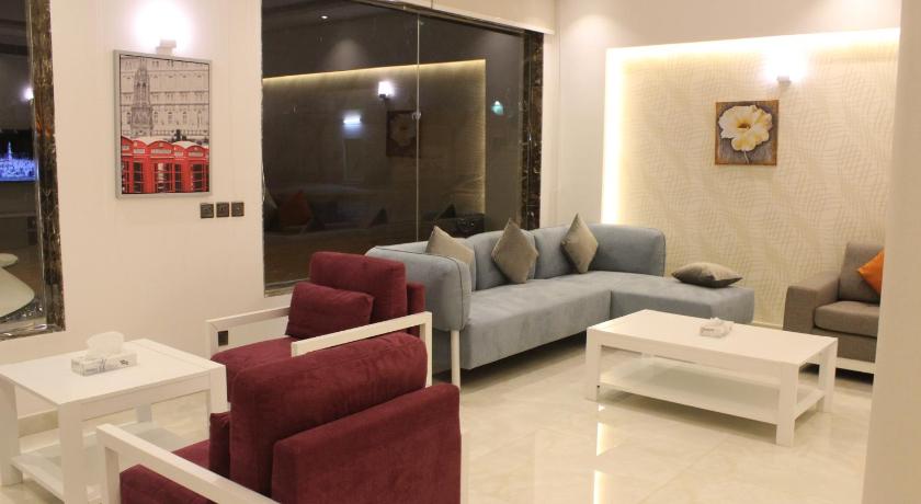 a living room filled with furniture and a couch, Nital Furnished Apartment in Riyadh