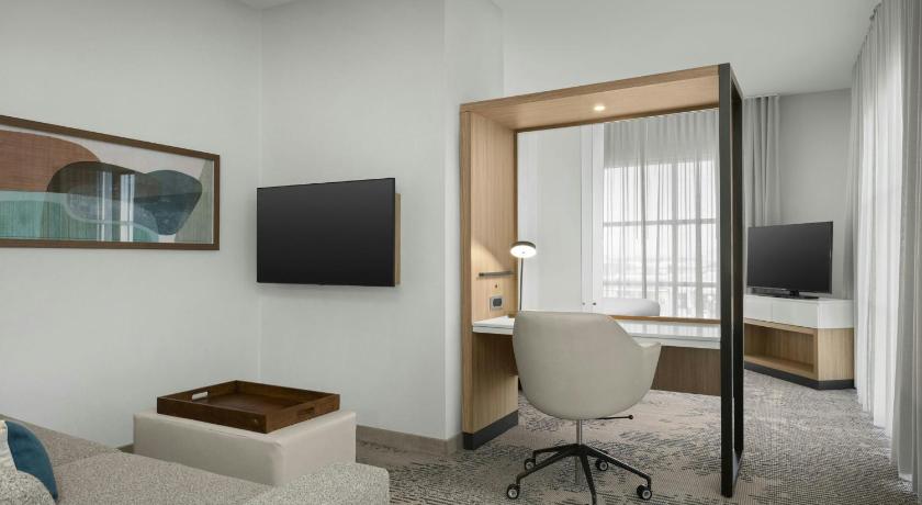 Image of One-Bedroom King Suite with Sofa Bed and Roll-In Shower - Mobility and Hearing Accessible 1