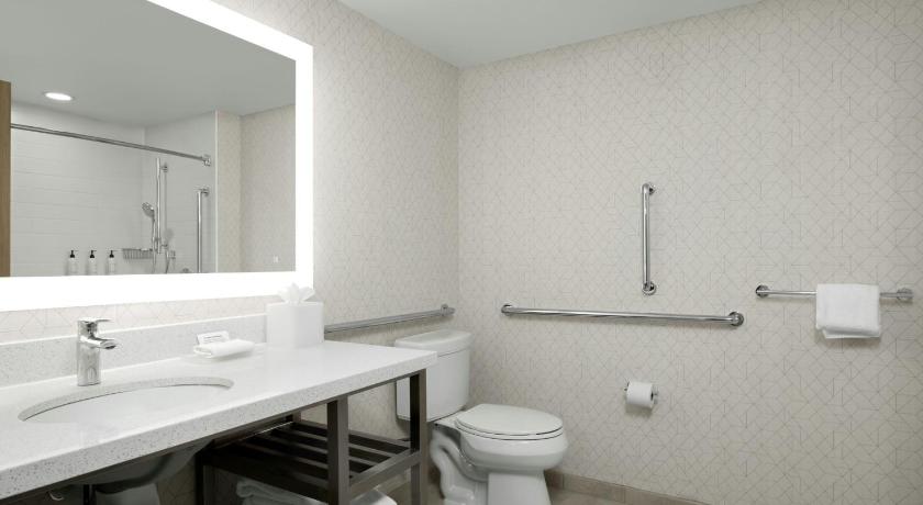 Image of One-Bedroom King Suite with Sofa Bed and Roll-In Shower - Mobility and Hearing Accessible 2