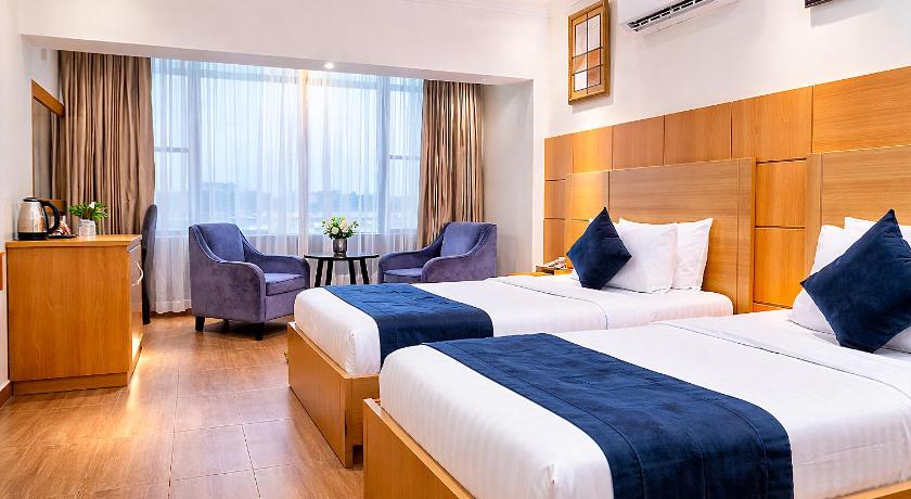 Image of Deluxe Queen Room with Two Queen Beds 1