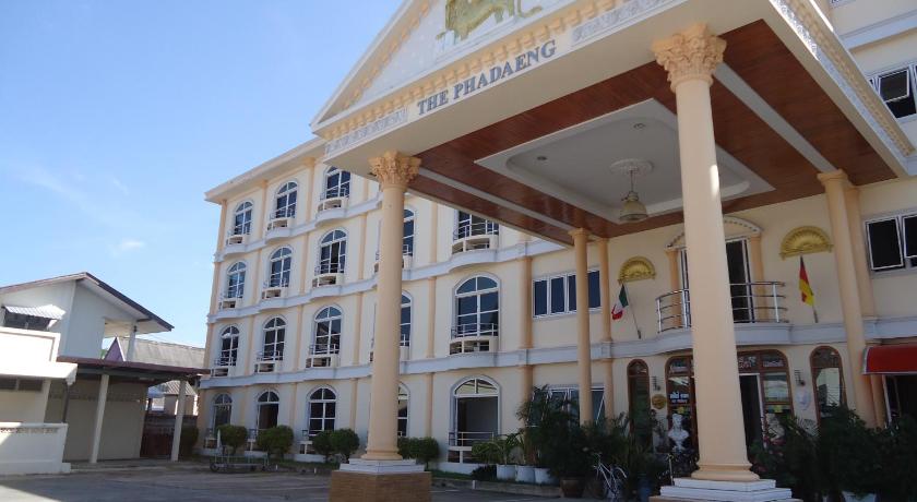 a large building with a clock on the front of it, Phadaeng Hotel in Ubon Ratchathani