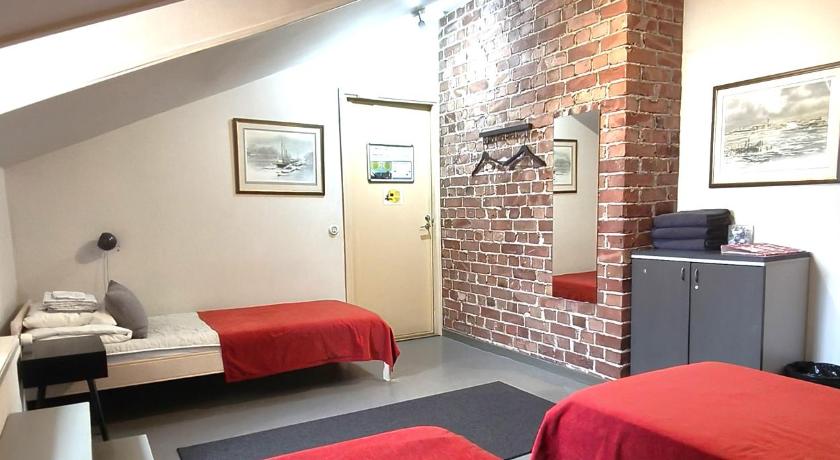 Image of Triple Room with Shared Bathroom 0