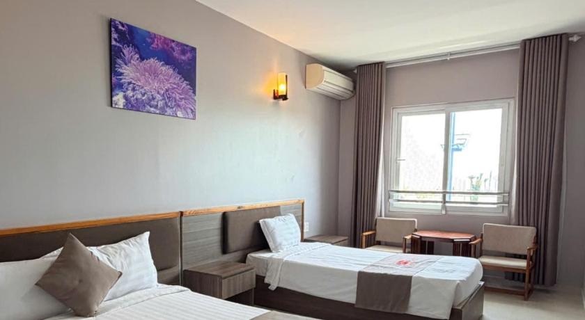 Image of Triple Room with Sea View 3