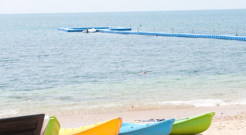 two blue and yellow surfboards sitting on top of a beach, Rawi Warin Resort & Spa (SHA Extra plus) in Koh Lanta