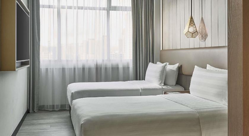 Image of Family Quadruple Room with 1 King Bed and 2 Single Beds 3