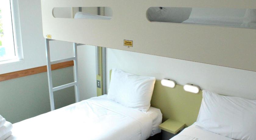 Image of Standard Room with 2 single beds and 1 bunk bed 1